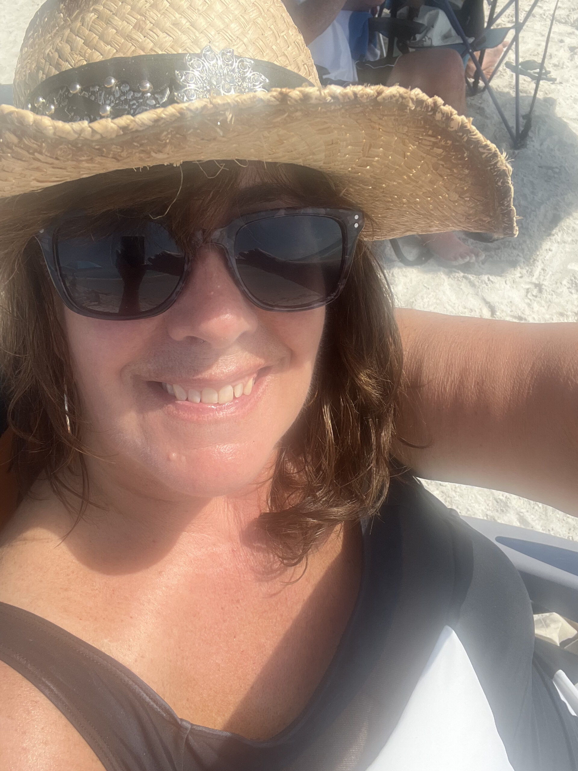 woman at beach after spray tan
